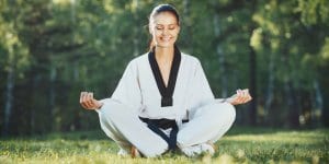 Martial Arts Lessons for Adults in Naperville IL - Happy Woman Meditated Sitting Background